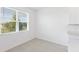 Charming breakfast nook filled with natural light from a window, complemented by gray tile flooring at 3054 Suraj Cir, Tavares, FL 32778