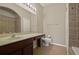 Bright bathroom featuring shower, bathtub combo, single sink vanity, and tile flooring at 889 Park Grove Ct, Orlando, FL 32828