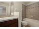 Cozy bathroom with a tiled shower and a neutral color scheme for a calming atmosphere at 889 Park Grove Ct, Orlando, FL 32828