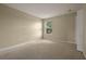 Bedroom featuring neutral carpet, one window, and closet space at 889 Park Grove Ct, Orlando, FL 32828