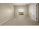 Cozy bedroom with neutral carpet, window and a closet at 889 Park Grove Ct, Orlando, FL 32828