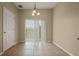 Sunlit dining area features tile flooring and sliding doors to the backyard at 889 Park Grove Ct, Orlando, FL 32828