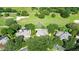 Aerial view of house and surrounding golf course at 25515 Hawks Run Ln, Sorrento, FL 32776