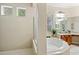 Spa-like bathroom with a soaking tub and walk-in shower at 25515 Hawks Run Ln, Sorrento, FL 32776