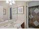 Bathroom with single sink vanity and shower at 25515 Hawks Run Ln, Sorrento, FL 32776