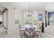 Cozy breakfast nook with a glass-top table and bay window at 25515 Hawks Run Ln, Sorrento, FL 32776