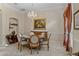 Elegant dining room with a chandelier and round table at 25515 Hawks Run Ln, Sorrento, FL 32776