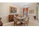 Elegant dining room with chandelier and hardwood floors at 25515 Hawks Run Ln, Sorrento, FL 32776
