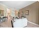 Spacious living room with light colored sofas and fireplace at 25515 Hawks Run Ln, Sorrento, FL 32776