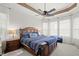 Main bedroom with a ceiling fan and large windows at 25515 Hawks Run Ln, Sorrento, FL 32776