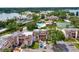 Aerial view of community with lake, pool, tennis courts and condo buildings at 206 Orienta Point St # 206, Altamonte Springs, FL 32701