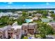 Aerial view of condo community with pool, tennis court, and lake access at 206 Orienta Point St # 206, Altamonte Springs, FL 32701
