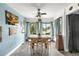 Bright dining area with wooden table and chairs, overlooking the pool at 206 Orienta Point St # 206, Altamonte Springs, FL 32701