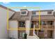 Condo exterior showcasing a two-story building with a unique roofline at 206 Orienta Point St # 206, Altamonte Springs, FL 32701