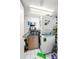 Stackable washer and dryer in a compact laundry room at 206 Orienta Point St # 206, Altamonte Springs, FL 32701