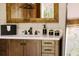 Stylish bathroom vanity with dark wood cabinets, a white countertop and bronze accents at 4600 Nebraska Ave, Sanford, FL 32771