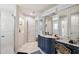 Elegant bathroom features a stylish vanity, marble countertop, and a walk-in shower for a luxurious experience at 4600 Nebraska Ave, Sanford, FL 32771