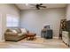 Cozy living room featuring a comfortable sofa, natural light, and neutral decor at 4600 Nebraska Ave, Sanford, FL 32771