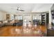 Bright and airy living room with hardwood floors, comfortable seating, and a seamless flow to adjacent dining areas at 4600 Nebraska Ave, Sanford, FL 32771