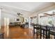 Open-concept living room with hardwood floors, high ceilings, and abundant natural light, perfect for entertaining guests at 4600 Nebraska Ave, Sanford, FL 32771