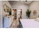 Main bedroom featuring a view to the bathroom with modern fixtures and decor at 4600 Nebraska Ave, Sanford, FL 32771