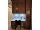 A charming built-in wooden desk area with chair, drawers, cabinets and white countertop provides a functional workspace at 840 Jasmine Creek Rd, Kissimmee, FL 34759
