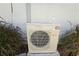 Outdoor AC unit surrounded by grassy plants at 840 Jasmine Creek Rd, Kissimmee, FL 34759