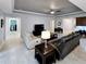 Open-concept living room featuring tile floors, neutral paint, piano, and comfortable seating with lots of natural light at 840 Jasmine Creek Rd, Kissimmee, FL 34759