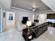 Spacious living room featuring tile flooring, a ceiling fan, and an open floor plan at 840 Jasmine Creek Rd, Kissimmee, FL 34759