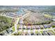 Residential neighborhood aerial view showcasing single-Gathering homes, mature trees, and community lakes at 840 Jasmine Creek Rd, Kissimmee, FL 34759