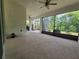 Screened in patio that has ample room for entertaining, with views of lush greenery at 840 Jasmine Creek Rd, Kissimmee, FL 34759