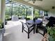 Spacious screened patio with ceiling fans and dining table for outdoor entertaining and relaxing at 840 Jasmine Creek Rd, Kissimmee, FL 34759