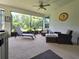 Relaxing screened patio with comfortable seating and views of the landscaped backyard at 840 Jasmine Creek Rd, Kissimmee, FL 34759