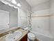 Bathroom features a vanity with granite countertop, toilet, and tub with shower head at 3125 Winesap Way, Winter Garden, FL 34787
