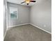 Standard carpeted bedroom is simple, offering lots of natural light and ample space at 3125 Winesap Way, Winter Garden, FL 34787