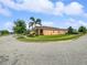 Well-maintained corner lot home with a landscaped yard, complemented by mature trees, creating a picturesque setting at 3125 Winesap Way, Winter Garden, FL 34787