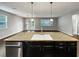 Open concept kitchen with island sink and stainless steel dishwasher at 3125 Winesap Way, Winter Garden, FL 34787