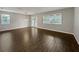 Open-concept living room with hardwood floors, neutral walls, and abundant natural light at 3125 Winesap Way, Winter Garden, FL 34787