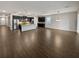 Open floor plan displays wood flooring, kitchen with island, and breakfast nook area at 3125 Winesap Way, Winter Garden, FL 34787