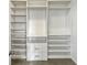 Walk-in closet featuring shelving units and drawers for ample storage space at 3125 Winesap Way, Winter Garden, FL 34787