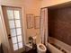 Clean bathroom with a tub, toilet and stylish decor at 9524 Bay Vista Estates Blvd, Orlando, FL 32836