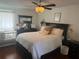 Bright bedroom with a queen-size bed, crib and plenty of natural light at 9524 Bay Vista Estates Blvd, Orlando, FL 32836