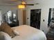 Main bedroom with a queen bed, large closet and hardwood floors at 9524 Bay Vista Estates Blvd, Orlando, FL 32836