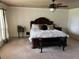 Spacious Primary bedroom with king-size bed and ceiling fan at 9524 Bay Vista Estates Blvd, Orlando, FL 32836