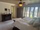Primary bedroom with large windows, walk-in closet, and a view at 9524 Bay Vista Estates Blvd, Orlando, FL 32836