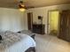 Primary bedroom with king bed, fireplace, and walk-in closet at 9524 Bay Vista Estates Blvd, Orlando, FL 32836