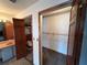 Bedroom with double door closet and wood shelving at 9524 Bay Vista Estates Blvd, Orlando, FL 32836