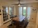Bright dining room featuring a spacious table and large windows at 9524 Bay Vista Estates Blvd, Orlando, FL 32836