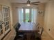 Dining room with a rustic wood table and metal chairs at 9524 Bay Vista Estates Blvd, Orlando, FL 32836