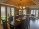 Spacious dining room with large table, and view into living room at 9524 Bay Vista Estates Blvd, Orlando, FL 32836